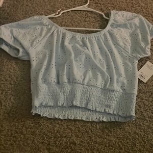 baby blue crop eyelet puffy sleeve shirt size L. never worn tags still on